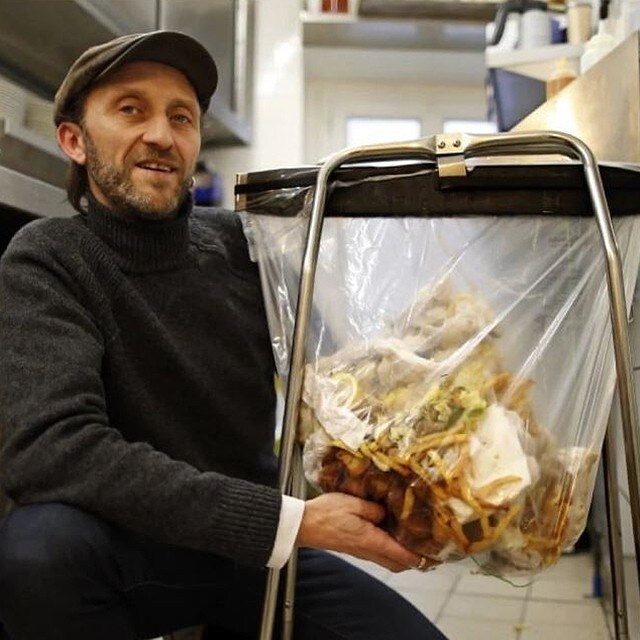 Man holding food waste bag Man holding food waste bag