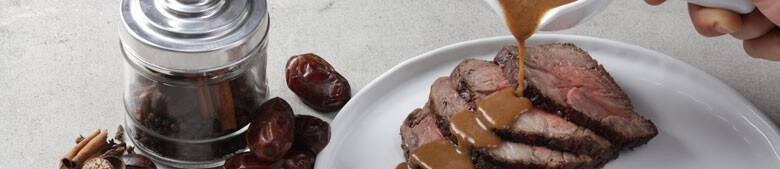roast beef with gravy being poured over it roast beef with gravy being poured over it